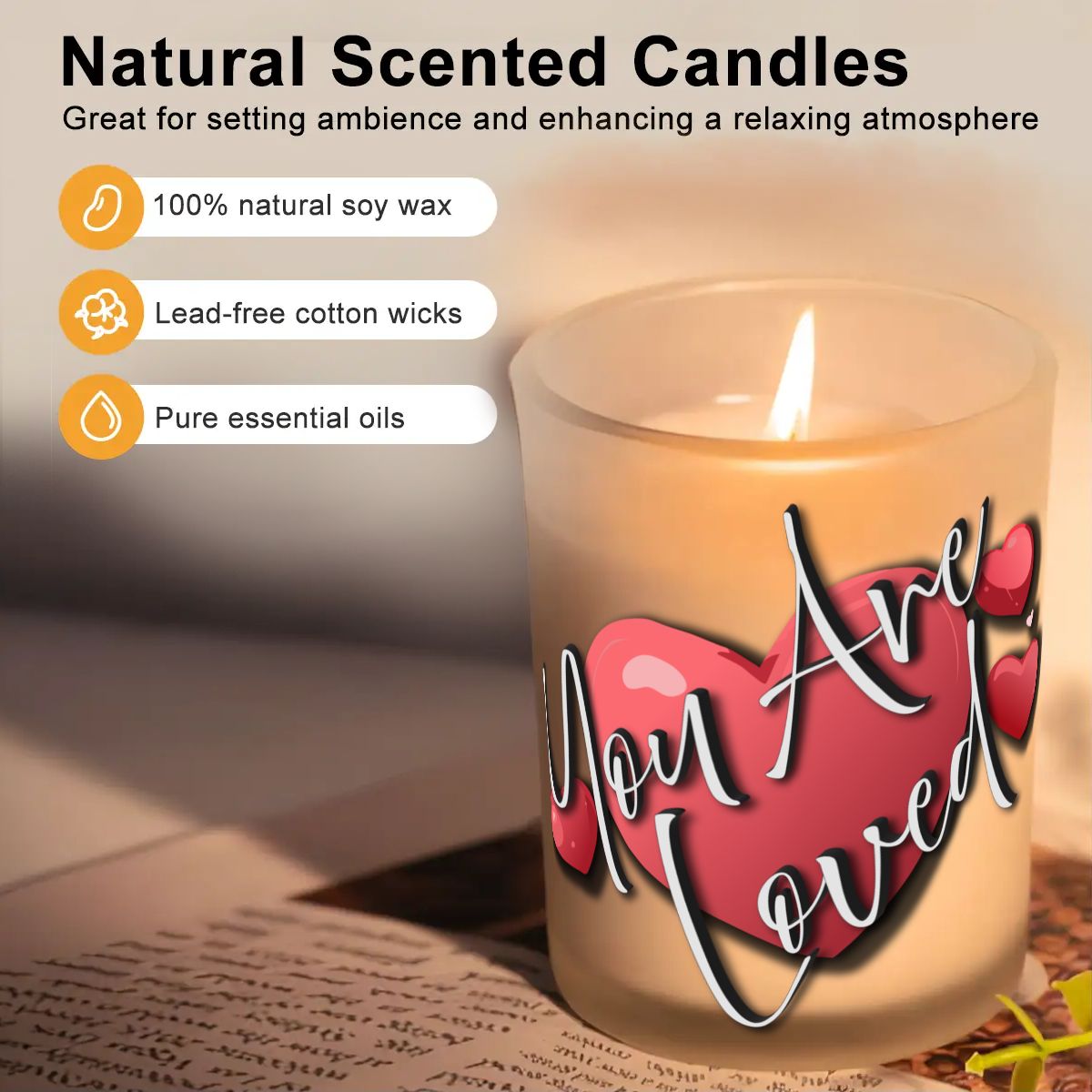 Candle with 'You Are Loved' text on a surface, featuring natural scented candle information.